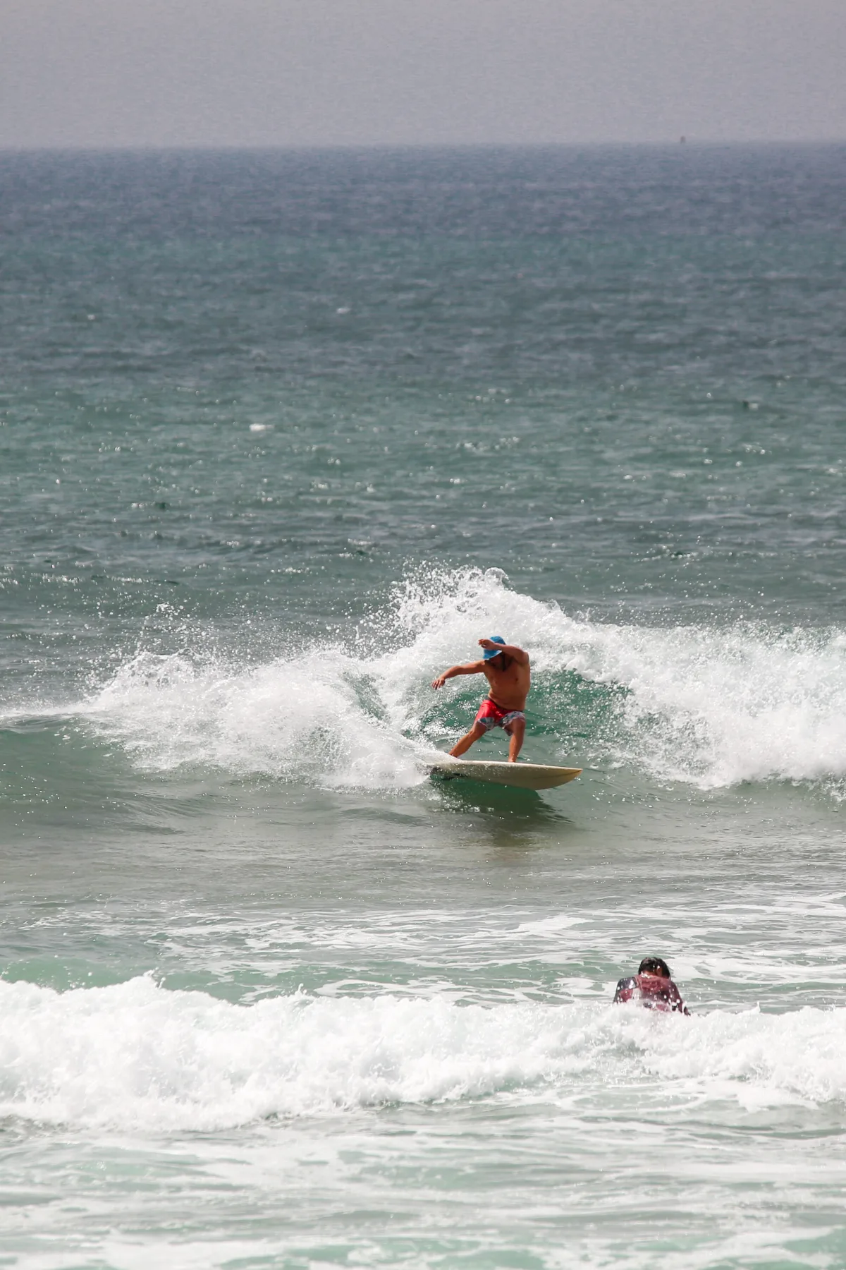 A surfer carving across an Atlantic wave